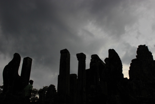 Sunset at Angkor Thom. A tour group scrambles to see the ruins before dark.
