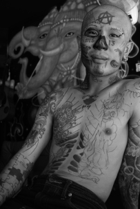 Skin deep. Phi Phi has a rich tattoo tourism industry & the artists don't disappoint. Notice the MS-13 gang signs near his nose.