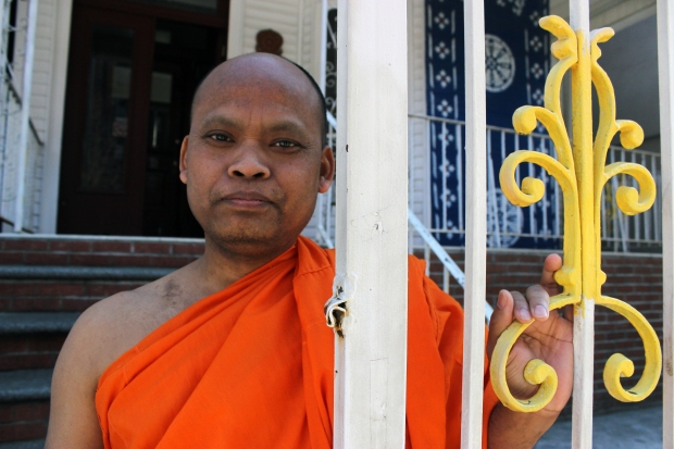 Venerable Kandaal Pheach stands outside the gateway to Wat Jotanaram, a Cambodian Buddhist temple in the Bronx that has a rich & endearing history. Pheach is concerned about the temple's future. 